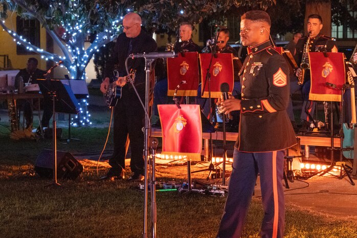 U.S. Marine Corps Staff Sgt. Adam Chandler, vocalist of Marine Band San Diego, sings during the 2023 holiday concert at Liberty Station in San Diego, Dec. 9, 2023. The concert is annual and featured Marine musicians performing a variety of holiday classics and seasonal favorites. The Marine Corps Bands inspire patriotism and represent American values through music. Chandler is from Wilmington, North Carolina.  (U.S. Marine Corps photo by Staff Sgt. Melissa L. Karnath)