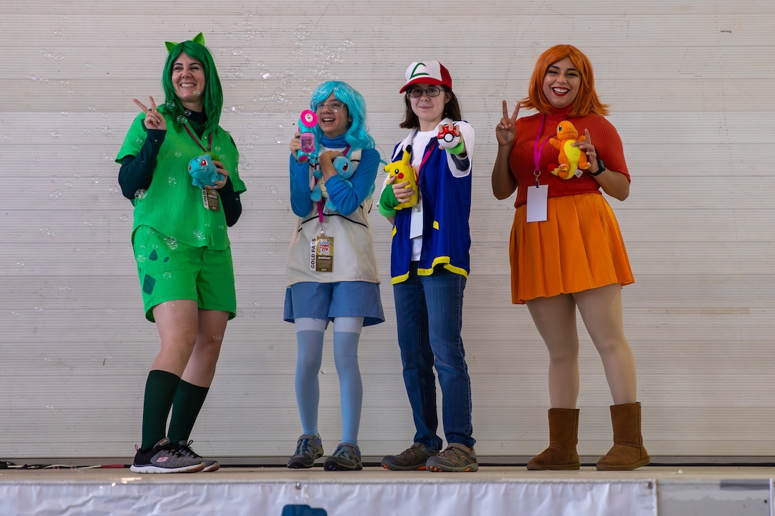 Cosplayers pose during the cosplay competition at the Comic Con Okinawa on Camp Foster, Okinawa, Japan, Dec. 3, 2023. Marine Corps Community Services Okinawa hosted a two-day comic convention, featuring professional cosplayers, comic artists, and voice actors during an open panel. MCCS provided food trucks, amusement rides, and video games. (U.S. Marine Corps photo by Cpl. Martha Linares)