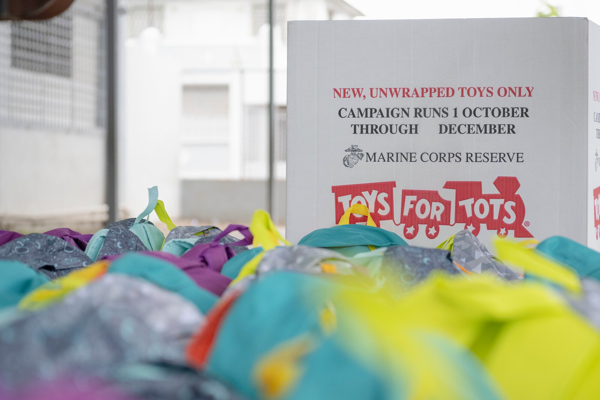 A detailed shot of backpacks during a toy distribution at Dr. Julio Henna Elementary School, San Juan, Puerto Rico, Dec. 14, 2023. The event was part of the campaign with Toys for Tots, where Puerto Rico Air National Guard members partnered with Marines to distribute more than 200 toys to children at a local school. (U.S. Air National Guard photo by 2nd Lt. Eliezer Soto)