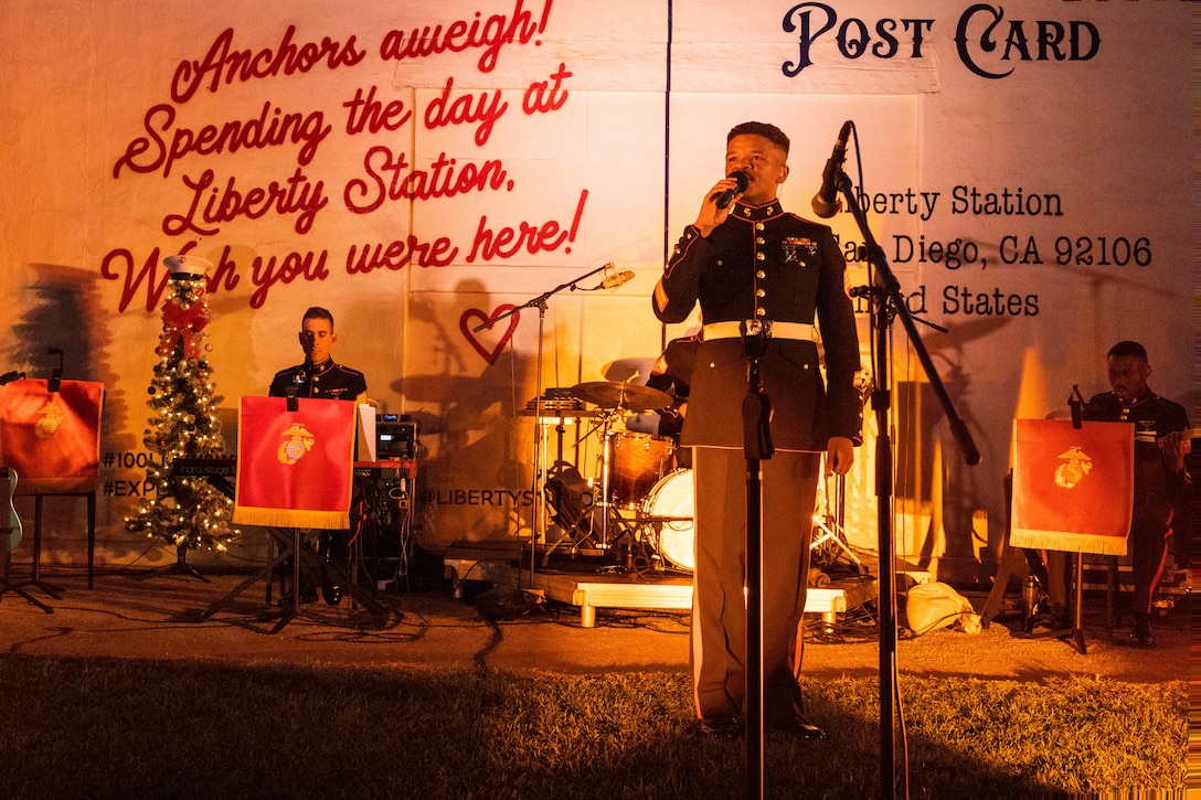 U.S. Marine Corps Staff Sgt. Adam Chandler, vocalist of Marine Band San Diego, sings during the 2023 holiday concert at Liberty Station in San Diego, Dec. 9, 2023. The concert is annual and featured Marine musicians performing a variety of holiday classics and seasonal favorites. The Marine Corps Bands inspire patriotism and represent American values through music. Chandler is from Wilmington, North Carolina.  (U.S. Marine Corps photo by Staff Sgt. Melissa L. Karnath)