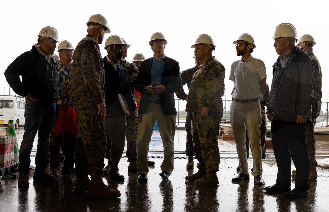 Marine Corps Air Station Futenma officials and Andrew Winternitz, Acting Deputy Assistant Secretary of Defense, look at renovations during a tour of MCAS Futenma, Okinawa, Japan, Dec. 4, 2023. MCAS Futenma leadership hosted a visit by several members of the Office of the Secretary of Defense to discuss current and future operations for the air station in the region. (U.S. Marine Corps photo by Cpl. Ricardo Deseanogomez)