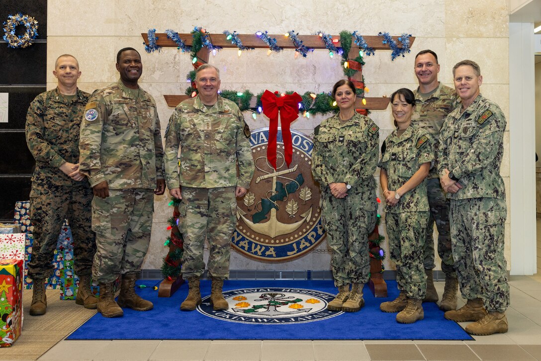 U.S. Air Force, Marine, and Navy senior leaders pose for a group photo during a distinguished visitor tour of U.S. Naval Hospital Okinawa on Camp Foster, Okinawa, Japan, Dec. 8, 2023. Air Force Lt. Gen. Ricky Rupp, commander of U.S. Forces Japan, and Chief Master Sgt. Leon Calloway, command senior enlisted leader of U.S. Forces Japan, visited the hospital to take a tour, and discuss current and future operational changes to the hospital. (U.S. Marine Corps photo by Cpl. Thomas Sheng)