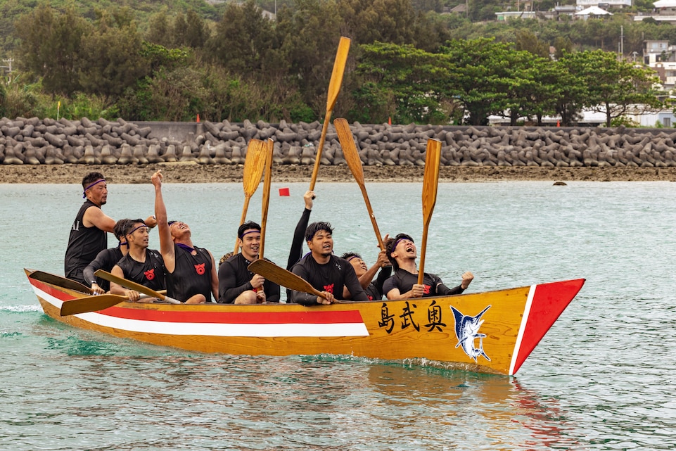 Nirai, a dragon boat racing team, celebrate after winning the men’s bracket during the Ojima Island Dragon Boat Race in Nanjo City, Okinawa, Japan, June 21, 2023. Dragon boat racing was first introduced to Okinawa from China around 600 years ago and was popularized in southern cities. Dragon boat races are held every year on the fifth month of the Lunar calendar. Ojima Island’s dragon boat race has three teams per heat, and 11 members per team. (U.S. Marine Corps photo by Cpl. Thomas Sheng)