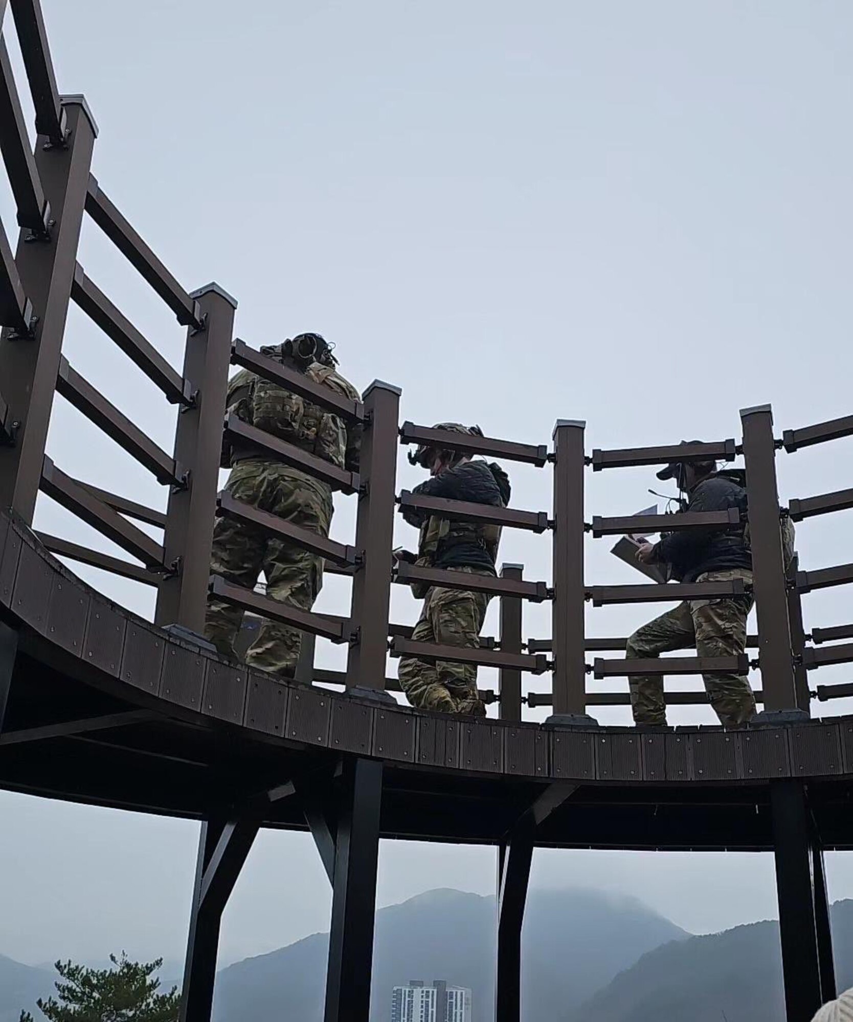 From the left, U.S. Air Force Chief Master Sgt. Dax Keehu, Staff Sgt. Kyle Townzen, and Airman 1st Class Caleb Kindler, 607th Air Support Operations Group joint terminal attack controllers, direct A-10C Thunderbolt IIs assigned to the 25th Fighter Squadron, during routine training event EPIC FOG 24-1 at an undisclosed location in the Republic of Korea, Dec. 14, 2023. The training event brought together joint and international partners to focus on close air support, airborne forward air control, and air-to-air refueling skills. (U.S. Air Force courtesy photo)