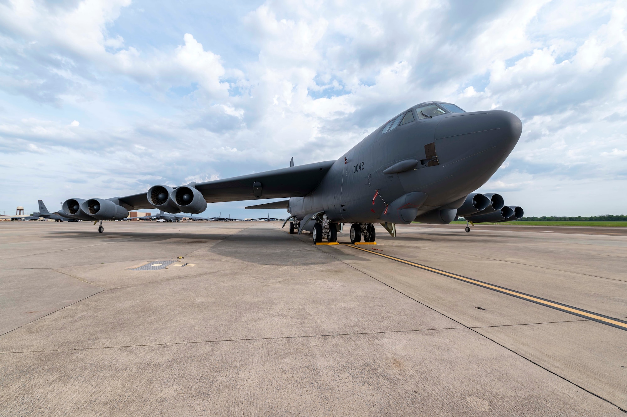 A B-52 Stratofortress sits on the flight line.