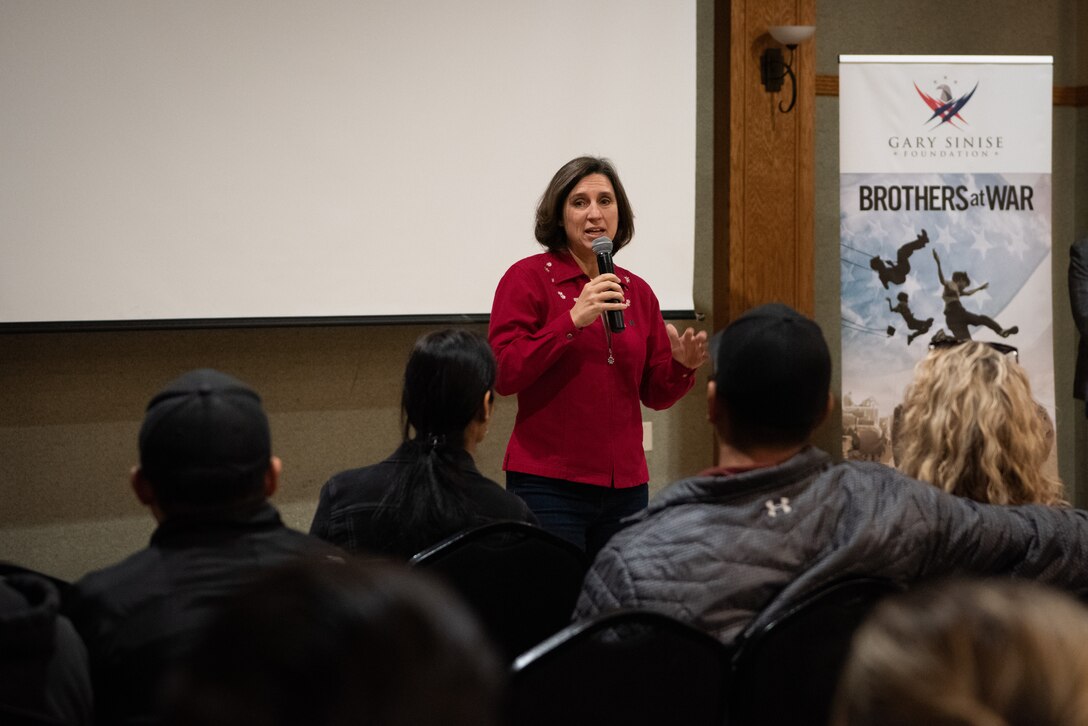 Col. Adria Zuccaro, Commander of the 128th Air Refueling Wing, speaks before Airmen from the 128th Air Refueling Wing convened at the Oak Creek Community Center for a seminar on dealing with difficulties incurred by military service called Brothers at War and sponsored by the Gary Sinise Foundation, Dec. 3, 2023. The event. coordinated by the Airman & Family Readiness Center. served to further a sense of community and connection among wing Airmen. (U.S. Air National Guard photo by Airman Cynthia Yang)