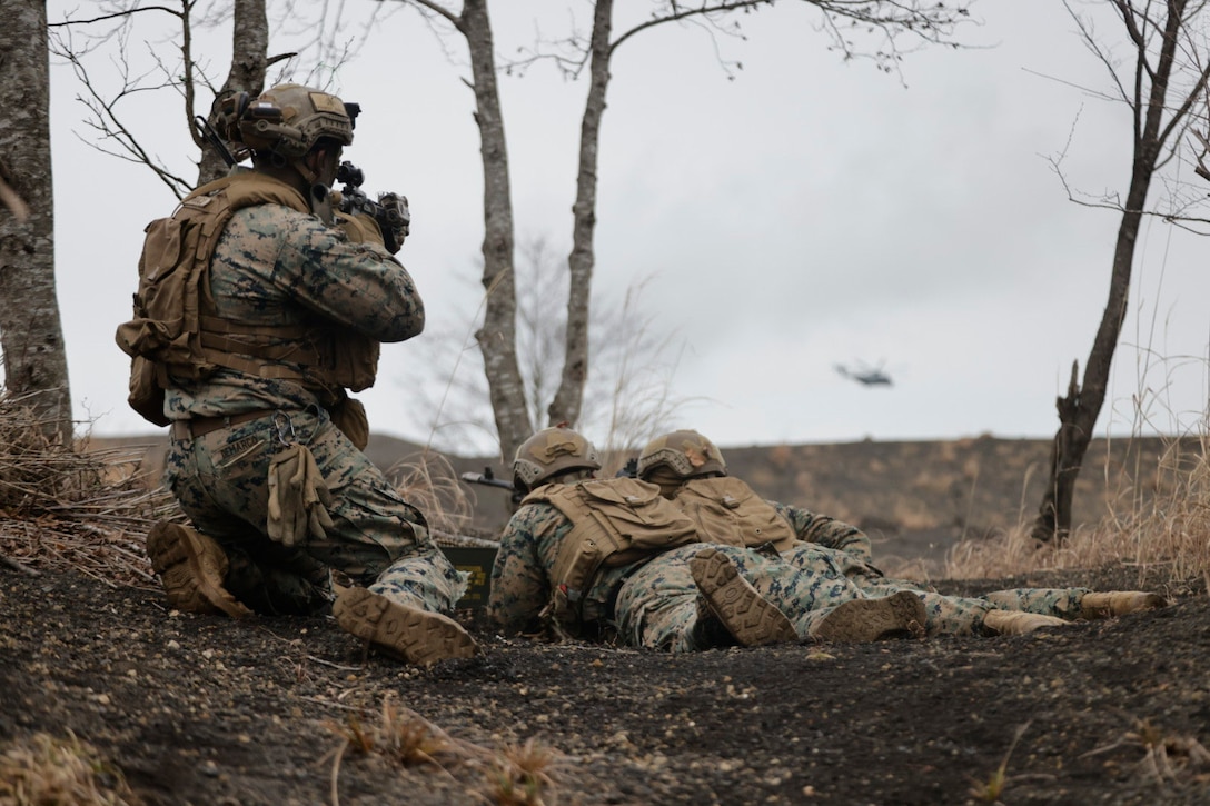 U.S. Marines with 2d Battalion, 7th Marine Regiment prepare for an ambush during Stand-in Force Exercise 24 at Combined Arms Training Center Camp Fuji, Japan, Dec. 5, 2023. SIFEX 24 is a division-level exercise involving all elements of the Marine Air-Ground Task Force focused on strengthening multi-domain awareness, maneuver, and fires across a distributed maritime environment. This exercise serves as a rehearsal for rapidly projecting combat power in defense of allies and partners in the region. 2/7 is forward deployed in the Indo-Pacific under 4th Marine Regiment, 3d Marine Division as part of the Unit Deployment Program. (U.S. Marine Corps photo by Cpl. Scott Aubuchon)