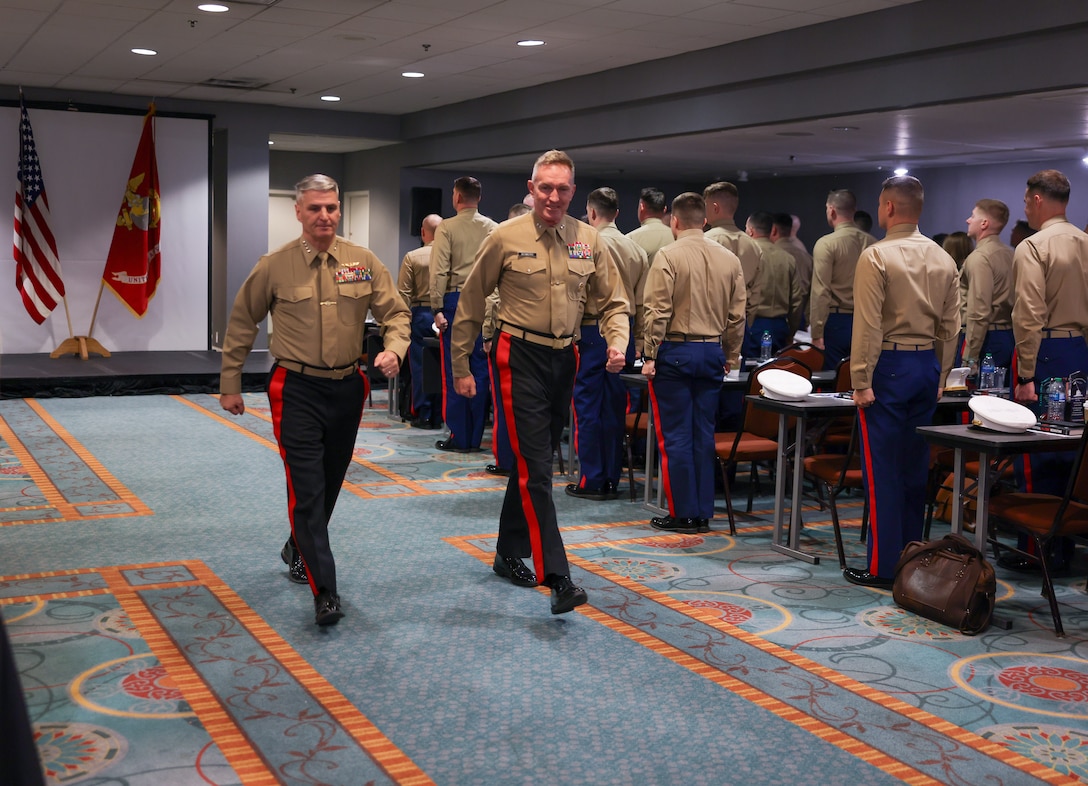 U.S. Marine Corps Gen. Christopher Mahoney, left, the assistant commandant of the Marine Corps, and Maj. Gen. William Bowers, the Marine Corps Recruiting Command commanding general, step out during the National Officer Selection Officer Training Symposium (NOSOTS) at Nashville, Tennessee, Dec. 12, 2023.  The NOSOTS is held for officer selection officers from around the nation to share strategies, voice concerns, and gain familiarity with new programs and skills.  (U.S. Marine Corps photo by Sgt. Bernadette Pacheco)