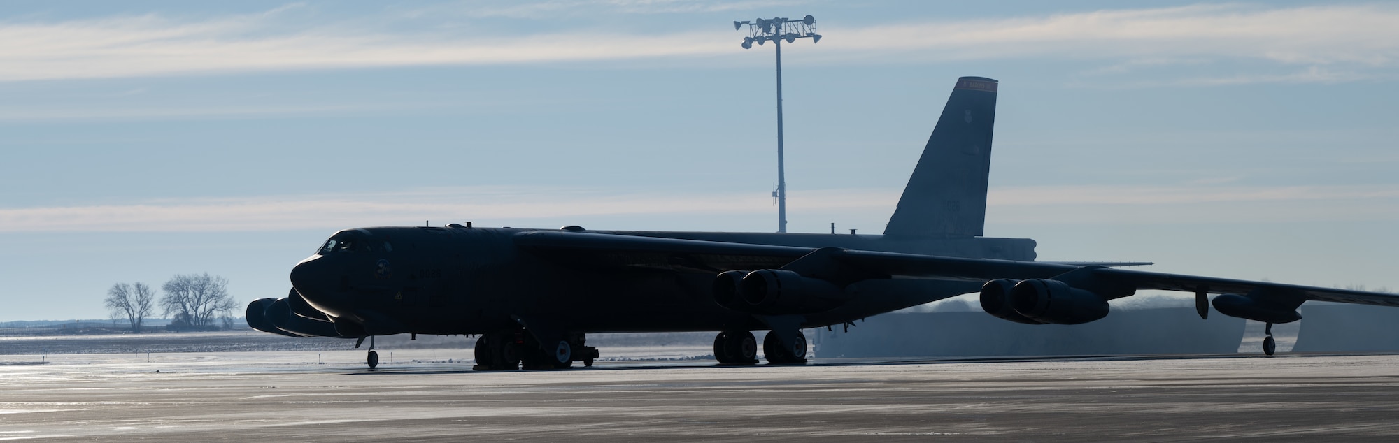 A B-52H Stratofortress, assigned to the 23rd Bomb Squadron, idles on the flight line during SURGE Week at Minot Air Force Base, North Dakota, Dec. 13, 2023. SURGE Week benefits Airmen by providing a training opportunity to learn and showcase operational strengths. (U.S. Air Force photo by Airman 1st Class Alyssa Bankston)