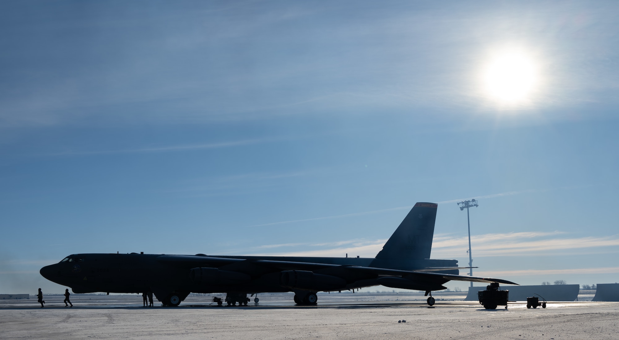 Airmen assigned to the 5th Aircraft Maintenance Squadron prepare a B-52H Stratofortress for SURGE Week on the flight line at Minot Air Force Base, North Dakota, Dec. 13, 2023. SURGE Week benefits Airmen by providing a training opportunity to learn and showcase mission strengths. (U.S. Air Force photo by Airman 1st Class Alyssa Bankston)