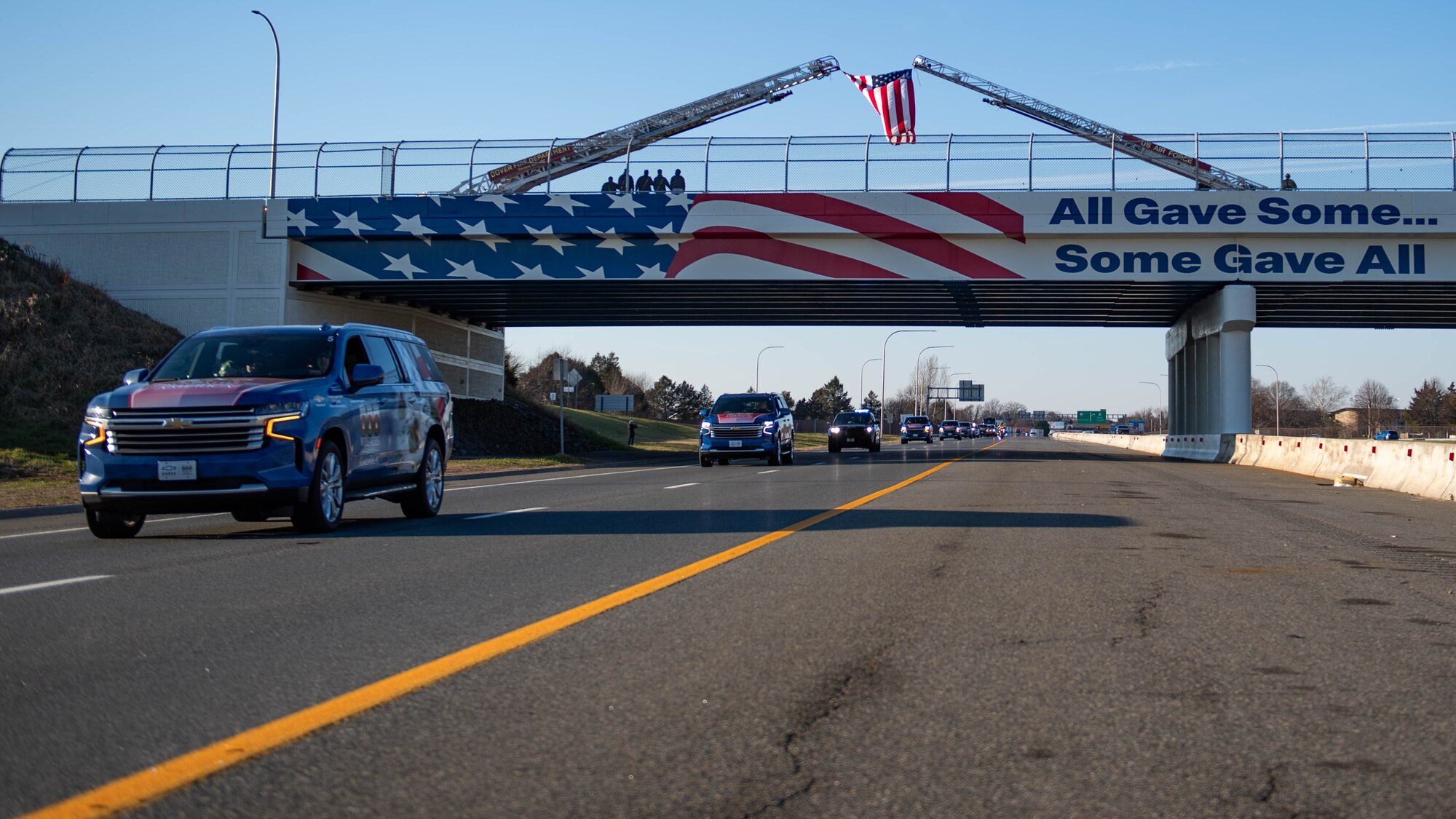 The Wreaths Across America Parade crosses under the Old Lebanon bridge near Dover Air Force Base, Delaware, Dec. 14, 2023. The mission of WAA is to honor those who served while teaching the next generation the value of freedom. (U.S. Air Force photo by Tech. Sgt. J.D. Strong II)