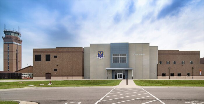 operations building from the parking lot with the control tower to the right.