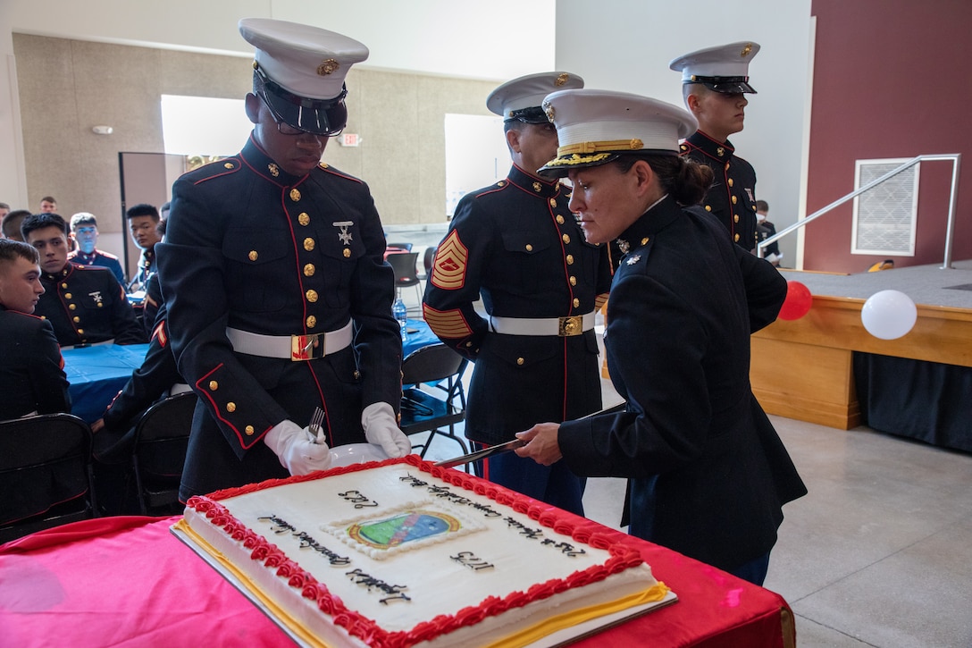 U.S. Marine Corps Lt. Col. Amber Coleman, commanding officer of Logistics Operations School, right, cuts a birthday cake during a ceremony on Camp Gilbert H. Johnson, North Carolina, Nov. 8, 2023. Marines with LOS gathered to celebrate the 248th birthday of the Marine Corps with a traditional ball and cake-cutting ceremony. (U.S. Marine Corps photo by Lance Cpl. Kaylee Compton)