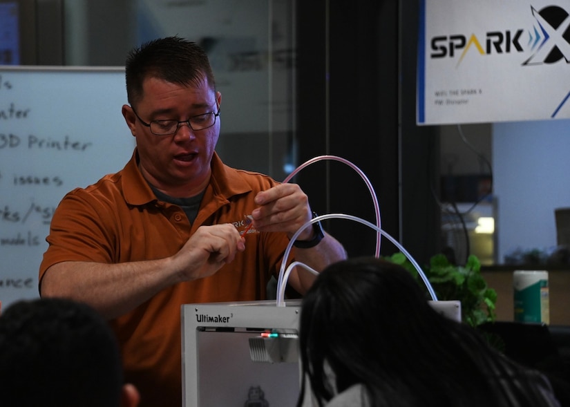 U.S. Air Force Staff Sgt. Chad Bohr, Spark X Cell technician, demonstrates 3D printer operations at the Spark X Idea and Innovation Center at Joint Base Andrews, Md., Dec. 1, 2023.