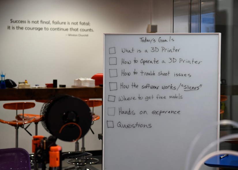 A whiteboard displays tasks for a 3D printing class at Joint Base Andrews, Md., Dec. 1, 2023.