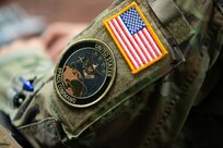 U.S. Space Command patch of an Airman during Space Development Training with New York Air National Guardsmen and representatives of the Brazilian Navy and Air Force, Niagara Falls, New York, Dec. 6, 2023. The New York National Guard and Brazil are partners in the Department of Defense National Guard Bureau State Partnership Program.