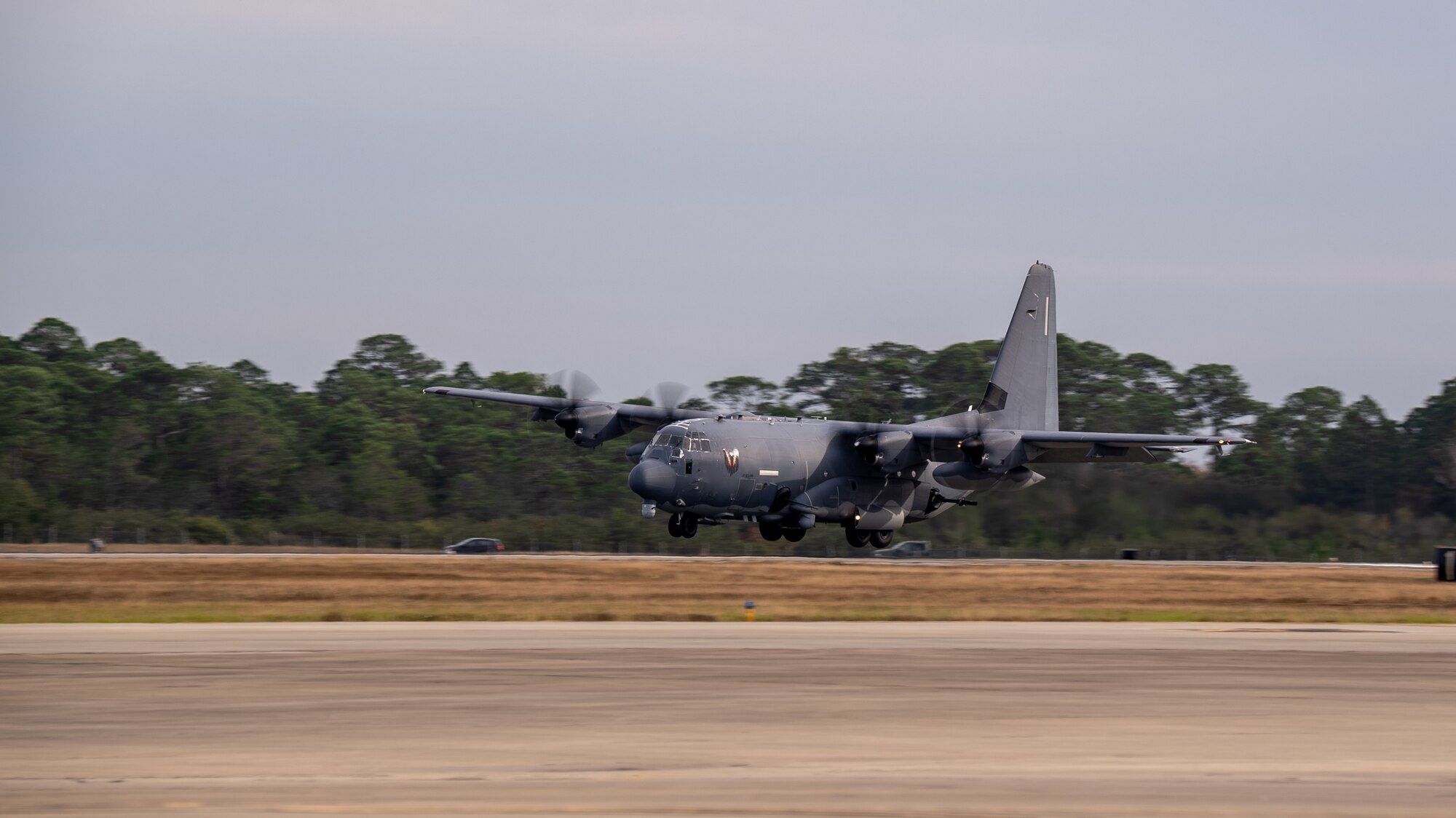 A U.S. Air Force AC-130J Ghostrider gunship performs a "touch-and-go” exercise at Hurlburt Field, Florida, Dec. 04, 2023. The AC-130J’s primary missions are close air support, air interdiction and armed reconnaissance.
