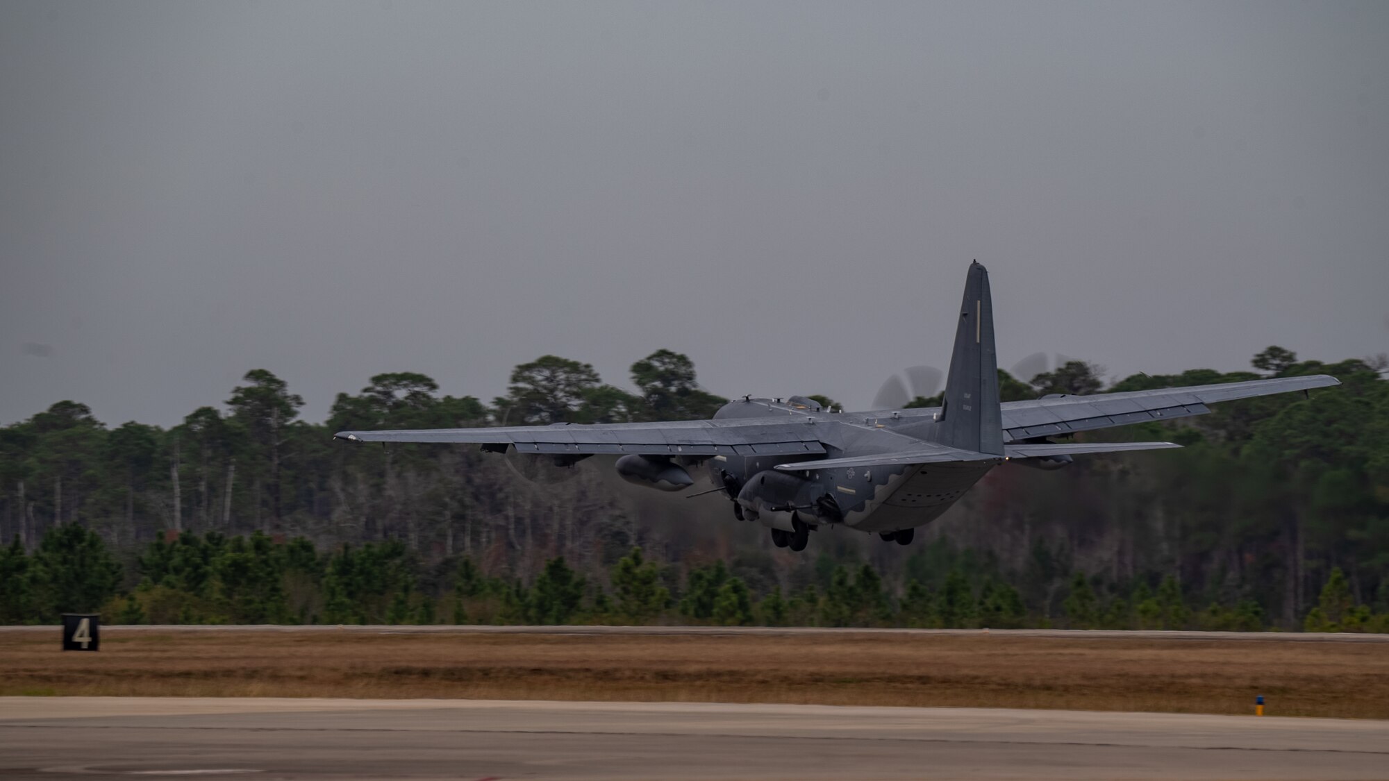 A U.S. Air Force AC-130J Ghostrider gunship takes off during  a "touch-and-go” exercise at Hurlburt Field, Florida, Dec. 04, 2023. The AC-130J’s primary missions are close air support, air interdiction and armed reconnaissance.