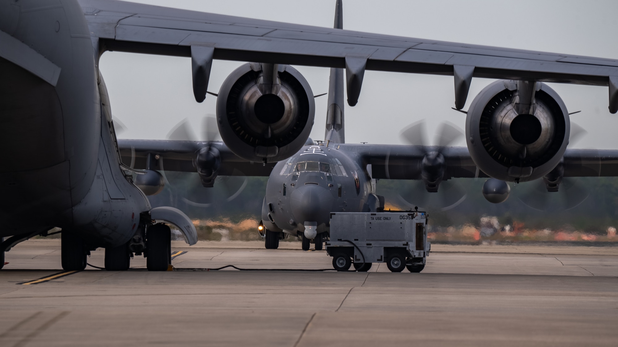 A U.S. Air Force AC-130J Ghostrider gunship taxis on the flightline at Hurlburt Field, Florida, Dec. 04, 2023. The AC-130J is a highly-modified aircraft that contains many advanced features such as a two-pilot flight station with fully integrated digital avionics.