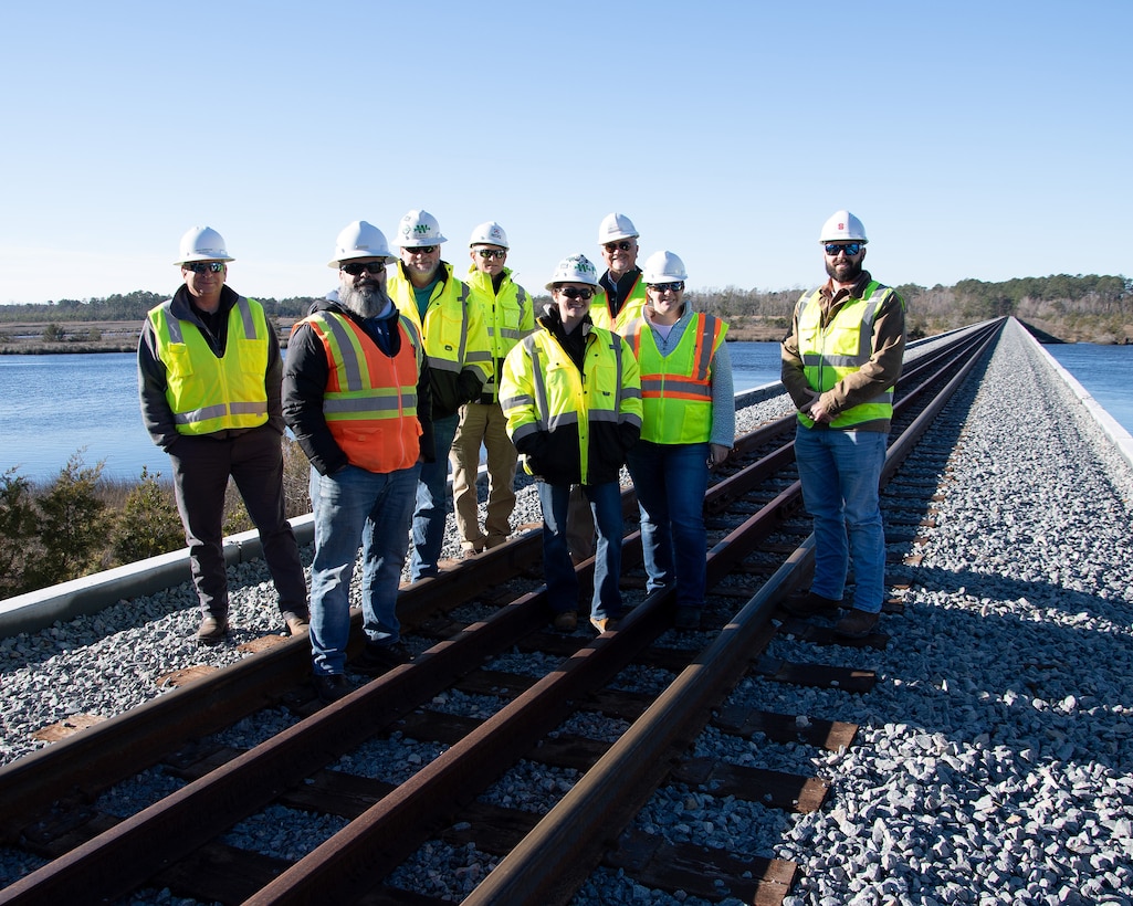 Members of Resident Officer in Charge of Construction Florence Camp Lejeune were able to celebrate the holiday’s a little early with the early completion of P-1505, the replacement project for two railroad trestles at Queens Creek and White Oak River, as well as the replacement of all railroad ties along the 34 mile line between Marine Corps Base Camp Lejeune and Marine Corps Air Station Cherry Point.



The original trestles received damage during Hurricane Florence in 2018. A restoration assessment and structural analysis recommended replacement due to numerous signs of structural decay.