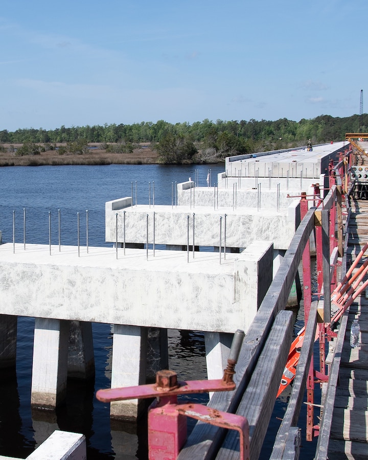 Members of Resident Officer in Charge of Construction Florence Camp Lejeune were able to celebrate the holiday’s a little early with the early completion of P-1505, the replacement project for two railroad trestles at Queens Creek and White Oak River, as well as the replacement of all railroad ties along the 34 mile line between Marine Corps Base Camp Lejeune and Marine Corps Air Station Cherry Point.



The original trestles received damage during Hurricane Florence in 2018. A restoration assessment and structural analysis recommended replacement due to numerous signs of structural decay.