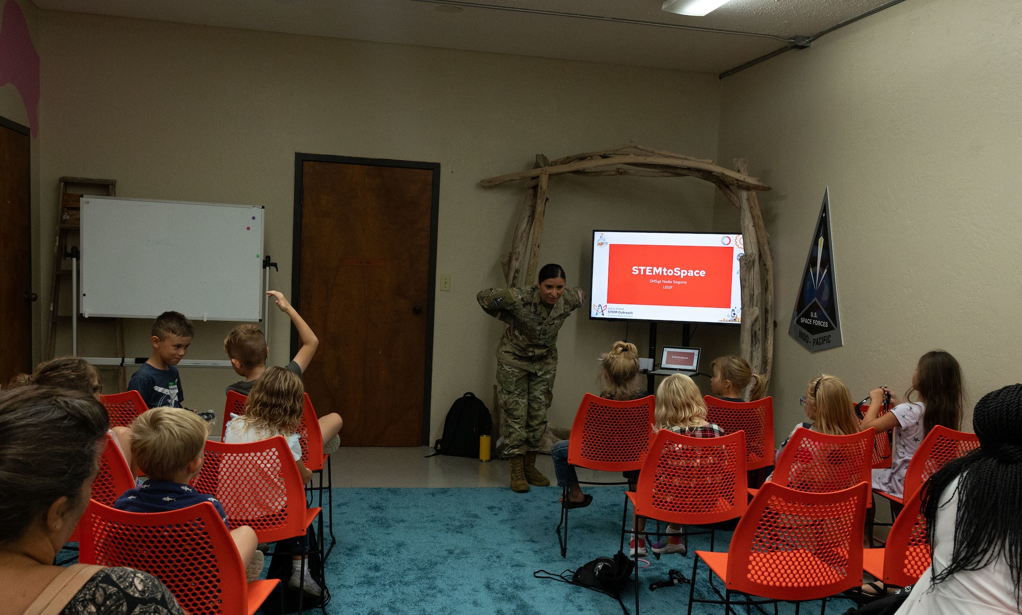 U.S. Space Force Senior Master Sgt. Nadia Segovia, U.S. Space Forces Indo-Pacific Senior Enlisted Leader to the Chief of Staff, talks to home school educators and students from around the island of Oahu about the Space Force during a Science, Technology, Engineering and Mathematics (STEM) to Space event in Honolulu, Hawaii, December 15, 2023. The event was in celebration of the Space Force’s fourth anniversary. STEM to Space was designed to facilitate virtual connections between Space Force Guardians and students to share the importance to STEM careers related to space. (U.S. Air Force photo by Tech. Sgt. Hailey Haux)