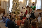 The Adjutant General of Colorado, U.S. Army Brig. Gen. Laura Clellan, reads to children of deployed Colorado National Guard members, Dec. 16, 2023, at the Boettcher Mansion in Denver.
The CONG Family Programs Office and Colorado Governors Office sponsor the annual gathering with loved ones away during the holiday season. (U.S. Air National Guard photo by SrA Melissa Escobar-Pereria)