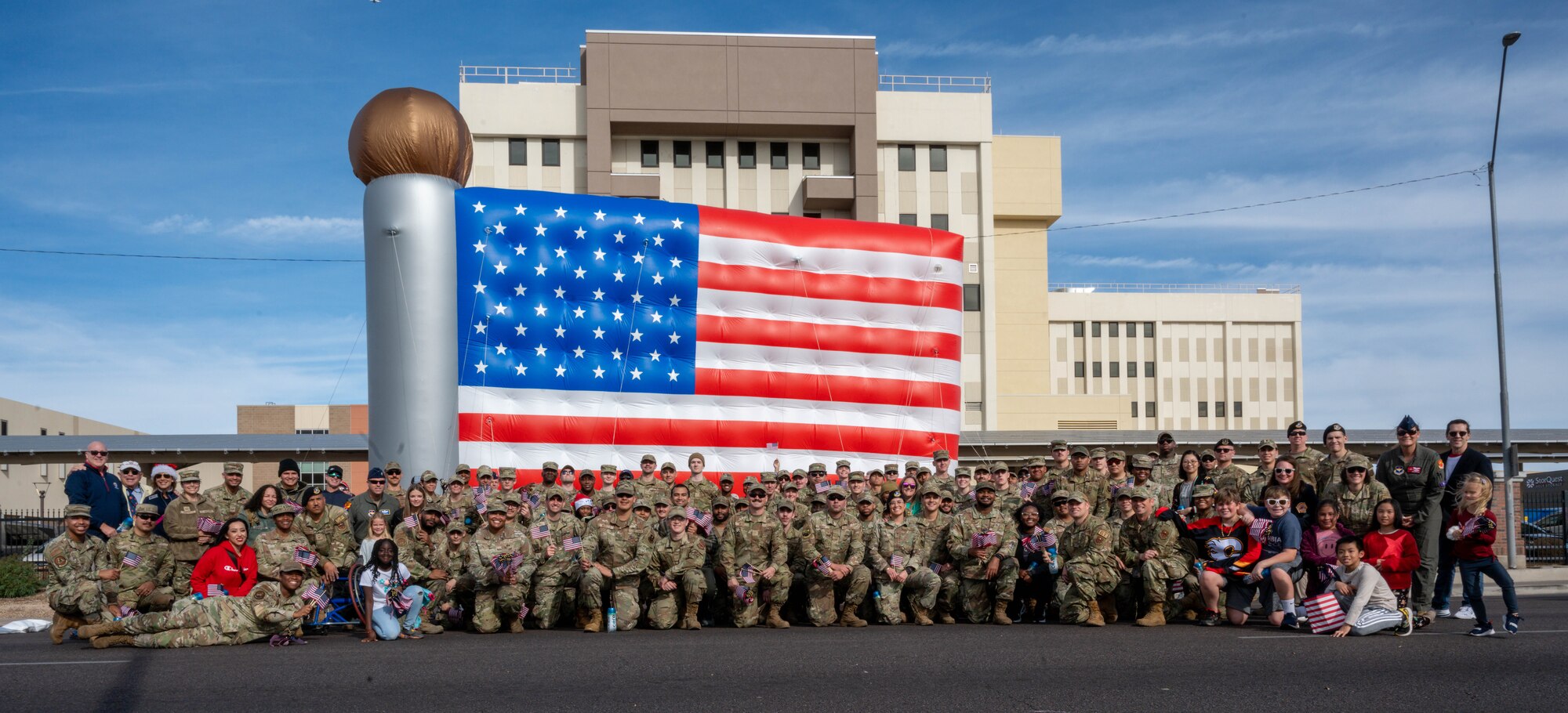 Airmen assigned to the 56th Fighter Wing pose for a photo at the end of the Fiesta Bowl Parade, Dec. 16, 2023, in Phoenix, Arizona.