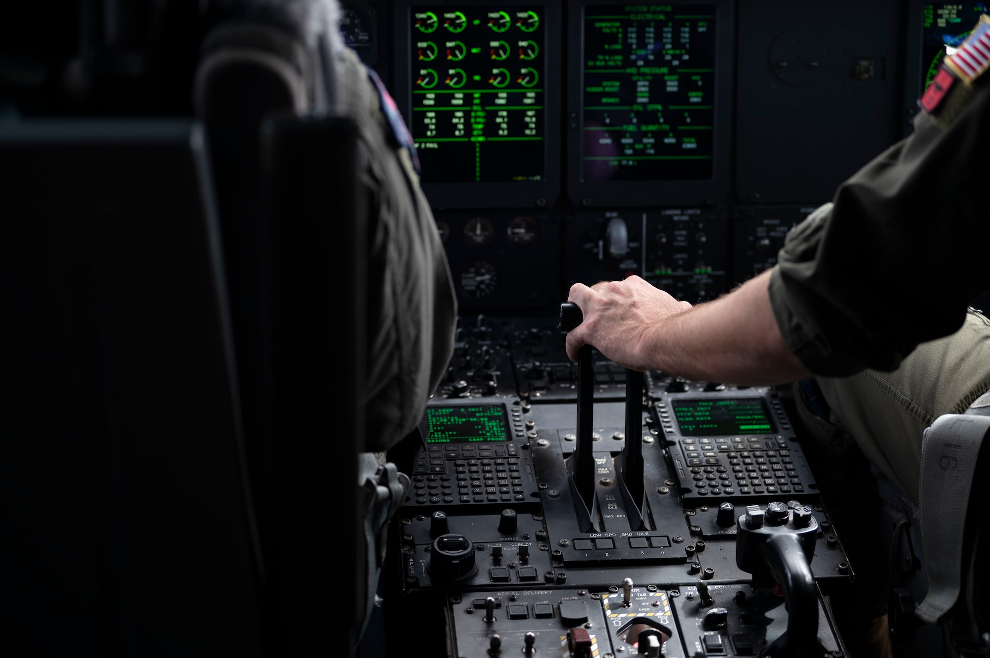 U.S. Air Force pilots fly a C-130J Super Hercules for Operation Christmas Drop over the Federated States of Micronesia, Dec. 3, 2023. This is OCD’s 72nd year delivering supplies such as clothes, toiletries, toys, fishing gear, and more across different islands of the Federated States of Micronesia. (U.S. Air Force photo by Airman 1st Class Audree Campbell)