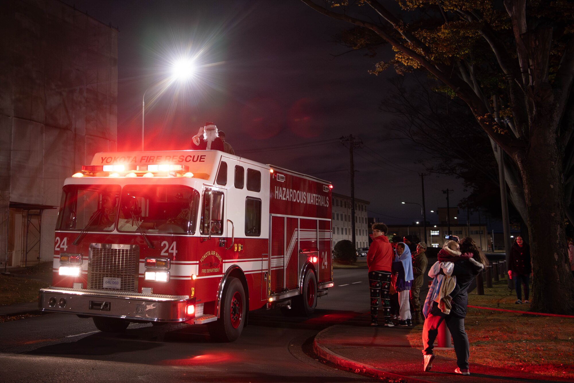 A fire truck transporting Santa Claus pulls up to the main chapel following a tree lighting ceremony at Yokota Air Base, Japan.