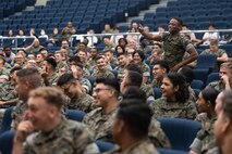 U.S. Marines and Sailors participate in conversation during a traffic safety education presentation in the base theater on Camp Foster, Okinawa, Japan, Sept. 15, 2023. This presentation was held to educate junior service members on the differences between driving in Japan and the United States, and to inspire Marines to make the right decisions before and while they are behind the wheel. (U.S. Marine Corps photo by Sgt. Maximiliano Rosas)