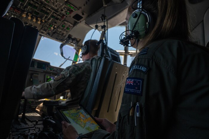 Pilots from the USAF and NZDF fly a C-130J Super Hercules.
