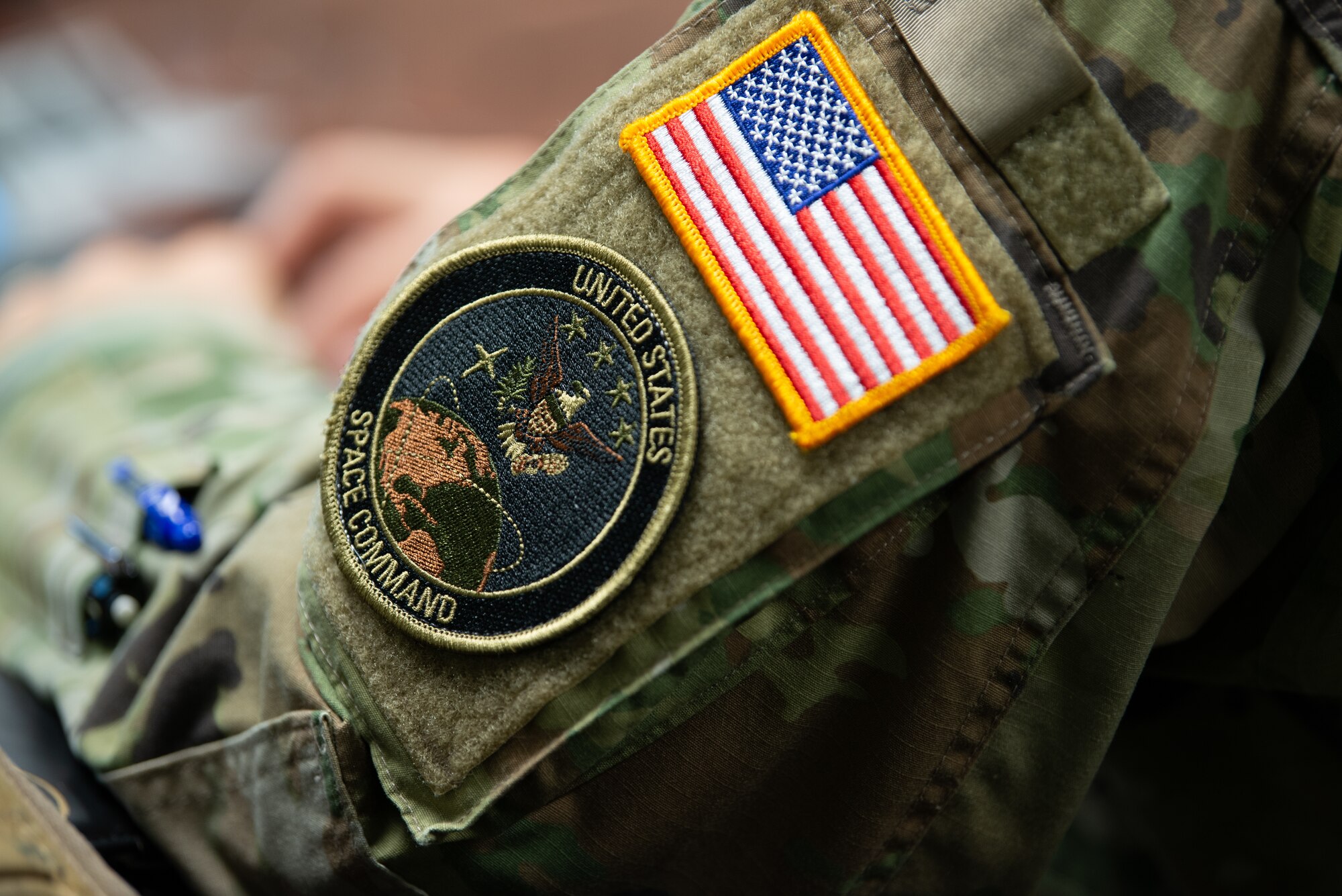 U.S. Space Command patch of an Airman during Space Development Training with New York Air National Guardsmen and representatives of the Brazilian Navy and Air Force, Niagara Falls, New York, Dec. 6, 2023. The New York National Guard and Brazil are partners in the Department of Defense National Guard Bureau State Partnership Program.