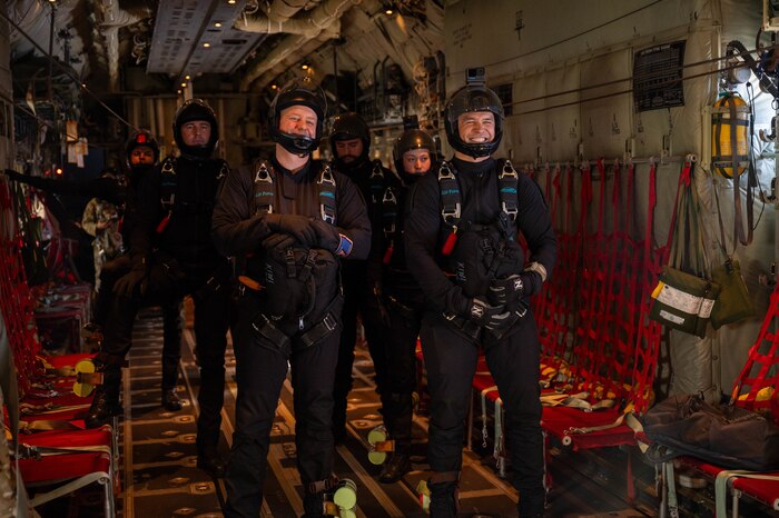 Members of the New Zealand Defense Force Kiwi Blue Parachute Team prepare for a high altitude-low opening jump