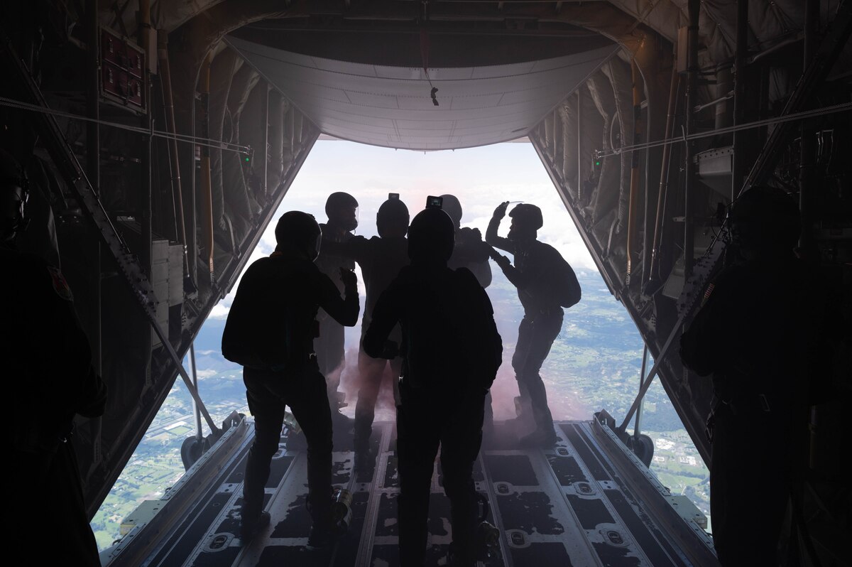 Members of the New Zealand Defense Force Kiwi Blue Parachute Team prepare for a high altitude-low opening jump.
