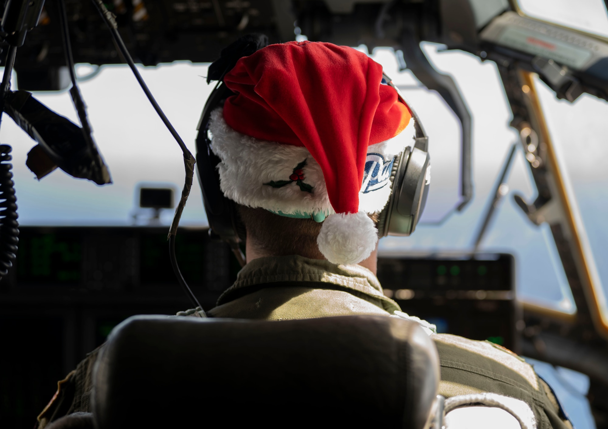 A U.S. Air Force pilot flies a C-130J Super Hercules for Operation Christmas Drop over the Federated States of Micronesia, Dec. 3, 2023.