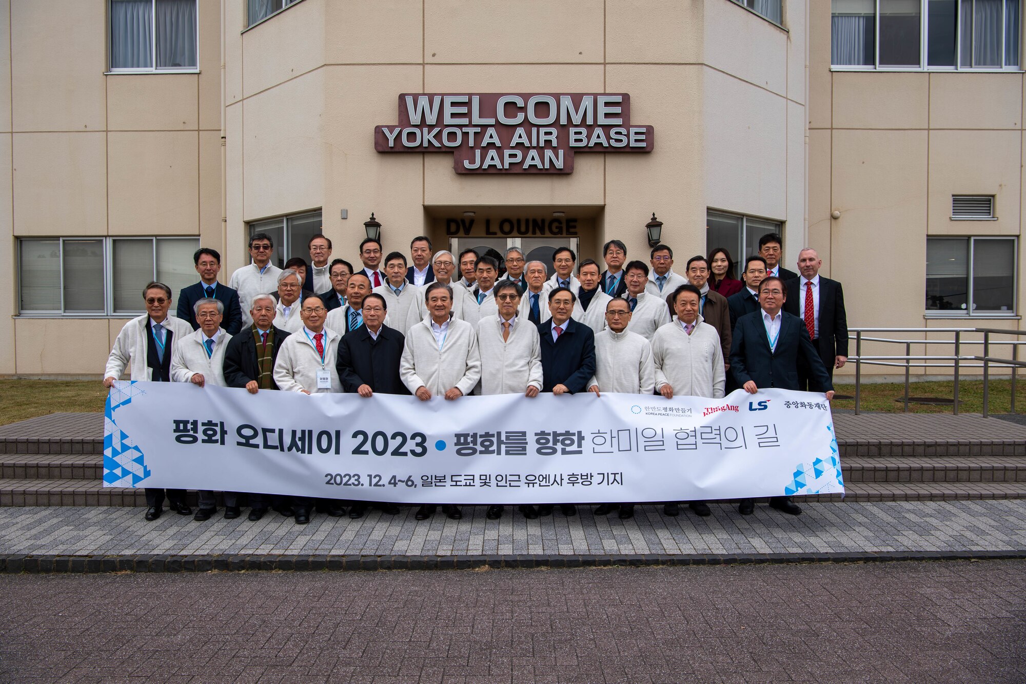 Members of the Korea Peace Foundation pose for a group photo at Yokota Air Base, Japan.