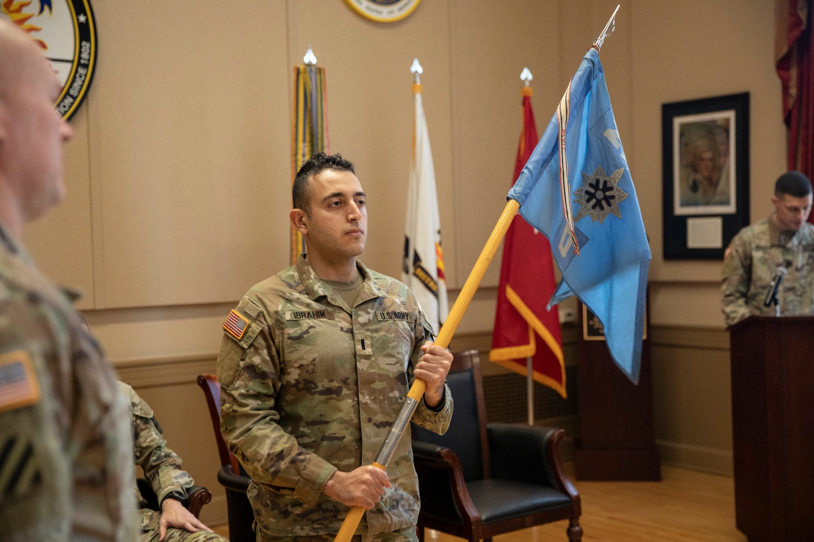 U.S. Army 1st Lt. John Ibrahim holds the guidon as the District of Columbia Army National Guard officially activates Delta Company, 223rd Military Intelligence Battalion during a ceremony Dec. 9, 2023, at the D.C. Armory in Washington, D.C. The unit is the first of its kind in the D.C. Army National Guard.   (U.S. Army National Guard photo by Sgt. 1st Class Erica Jaros)