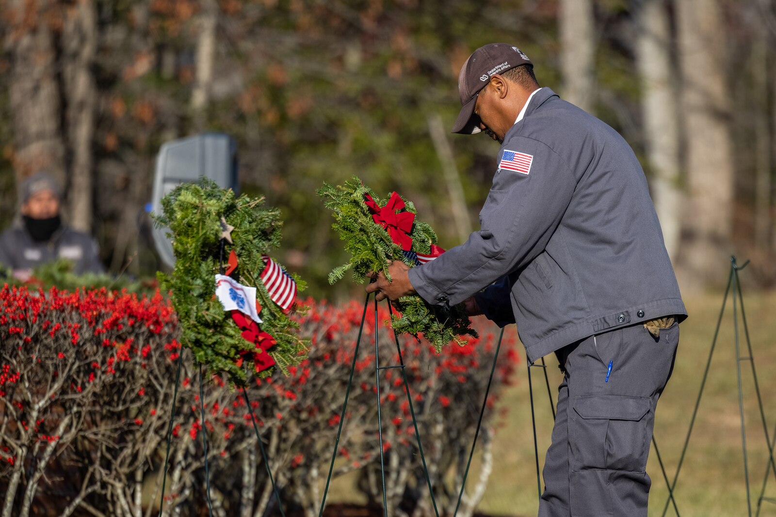 Jared Bennett, native of Fayetteville, North Carolina, and maintenance worker for the cemetery, lays a wreath for the Marine Corps during the annual Wreaths Across America wreath-laying ceremony at the National Cemetery at Quantico, Triangle, Virginia, Dec. 16, 2023. The event was held in unity with other cemeteries nationwide to remember and honor those who paid the ultimate sacrifice, but also to teach generations about those who have and currently serve. (U.S. Marine Corps photo by Lance Cpl. Ethan Miller)