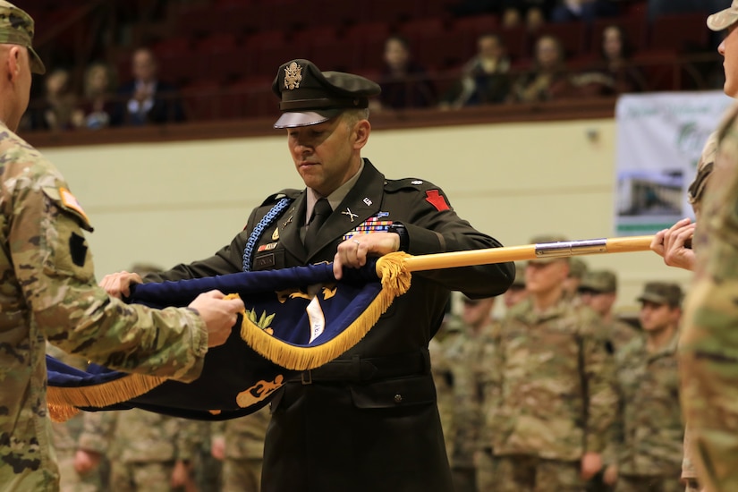Lt. Col. Eric Ponzek, commander of 2nd Battalion, 112th Infantry Regiment, cases the battalion colors, or a rallying flag, during a deployment ceremony at Zembo Shrine Auditorium in Harrisburg, Pennsylvania, Dec. 17, 2023. The casing and furling of the colors formally signals that the unit is ready for their mission. Soldiers with the Pennsylvania National Guard’s 2nd Battalion, 112th Infantry Regiment, 56th Stryker Brigade Combat Team, 28th Infantry Division and their families were recognized during the ceremony. The Soldiers will leave their homes and families for about a year as they deploy to the Horn of Africa, supporting U.S. Africa Command and partner forces with security objectives in the region. During the ceremony, Shapiro, Maj. Gen. Mark Schindler, Col. Christopher Costello and Lt. Col. Eric Ponzek shared remarks. (U.S. Army National Guard photo by Maj. Travis Mueller)
