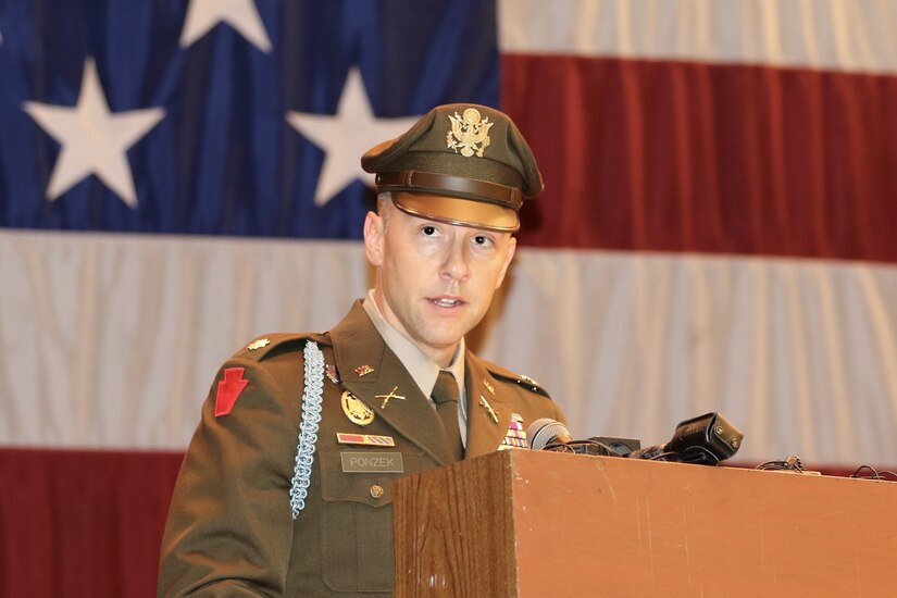 Lt. Col. Eric Ponzek, commander of 2nd Battalion, 112th Infantry Regiment, shares remarks during a deployment ceremony at Zembo Shrine Auditorium in Harrisburg, Pennsylvania, Dec. 17, 2023. Soldiers with the Pennsylvania National Guard’s 2nd Battalion, 112th Infantry Regiment, 56th Stryker Brigade Combat Team, 28th Infantry Division and their families were recognized during the ceremony. The Soldiers will leave their homes and families for about a year as they deploy to the Horn of Africa, supporting U.S. Africa Command and partner forces with security objectives in the region. During the ceremony, Gov. Josh Shapiro, Maj. Gen. Mark Schindler, Col. Christopher Costello and Ponzek shared remarks. (U.S. Army National Guard photo by Maj. Travis Mueller)