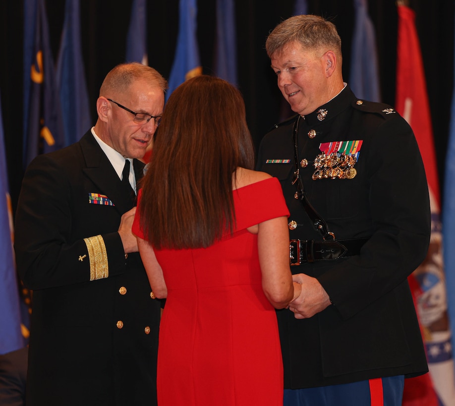 U.S. Marine Corps Col. Donald Wright, chief of staff of Marine Corps Base Quantico, a native of Universal City, Texas, right, renews his vows to his wife Norma, a native of Mexico City, Mexico, center, during his retirement ceremony on Marine Corps Base Quantico, Virginia, Dec. 15, 2023. Wright retired as chief of staff for the base after 30 years of honorable service, a career including tours of Iraq, Afghanistan, and Indonesia. (U.S. Marine Corps photo by Lance Cpl. David Brandes)
