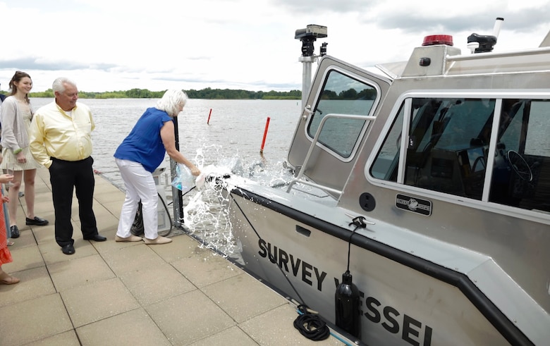 Cindy Zaiontz-DeFelice daughter of Mrs. Agnes Goodman Zaiontz, christens the new survey vessel Miss Agnes in a ceremony in Columbus, Mississippi, April 28, 2023. The Miss Agnes is newest survey vessel in the U.S. Army Corps of Engineers, Mobile District. (U.S. Army photo by Jeremy Murray)