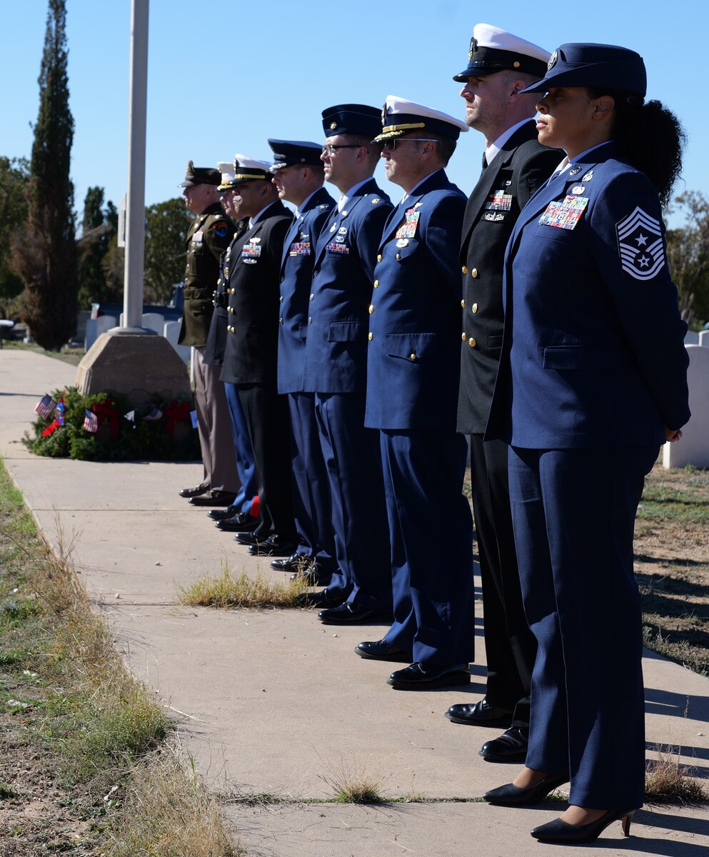 Leaders from every branch of the military assigned to Goodfellow Air Force Base stand at parade rest during the Wreaths Across America Ceremony at Belvedere Memorial Park Cemetery in San Angelo, Texas, Dec. 16, 2023. Goodfellow AFB leadership laid wreaths to honor every military branch, prisoners of war and those missing in action. (U.S. Air Force photo by Staff Sgt. Nathan Call)