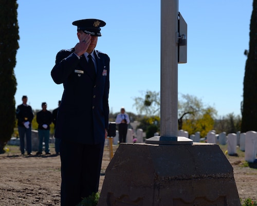 U.S. Air Force Col. Christopher Corbett, 17th Training Wing deputy commander, salutes after placing a wreath at the Wreaths Across America Ceremony at Belvedere Memorial Park Cemetery in San Angelo, Texas, Dec. 16, 2023. Corbett laid the wreath in honor of U.S. Air Force veterans. (U.S. Air Force photo by Staff Sgt. Nathan Call)
