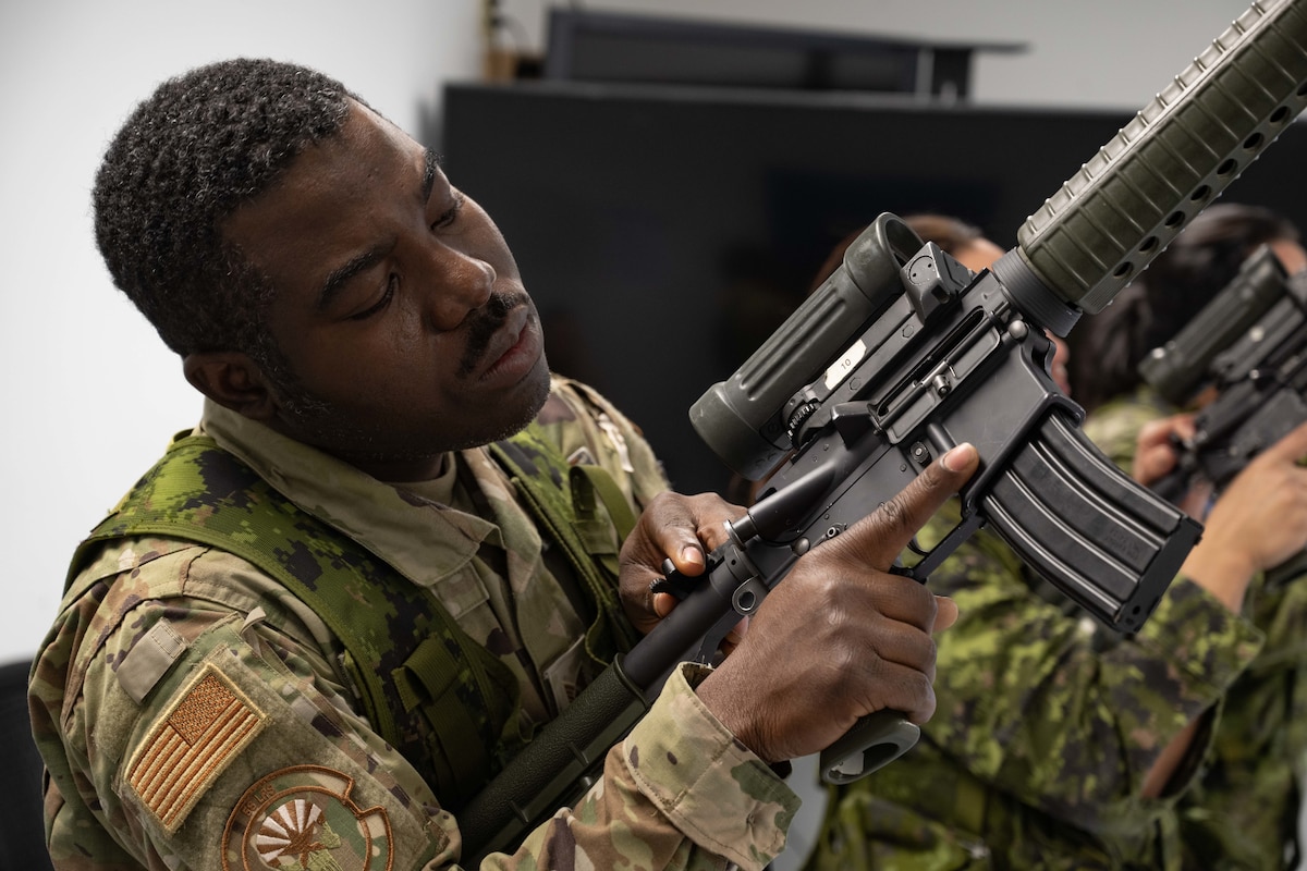 United States Air Force Material Management Quality Assurance evaluator, Technical Sergeant Sanvi Panou of the 56th Logistics Readiness Squadron at Luke Air Force Base, Arizona participate in weapons instructionals as a student during the Canadian Forces Primary Leadership Qualification course hosted by the Royal Canadian Air Force Academy at Canadian Forces Base Borden, Ontario, Canada on November 23, 2023.
