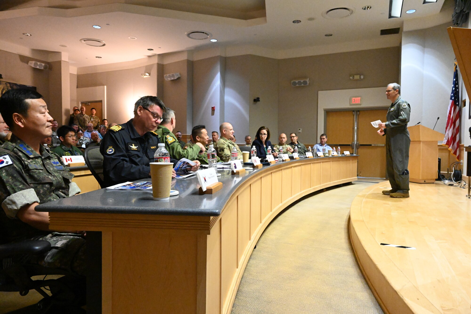 Gen. Ken Wilsbach, Pacific Air Forces commander, right, speaks to officers and subject matter experts from the United States, Australia, Canada, Japan, New Zealand, Republic of Korea and the United Kingdom during the Multilateral Integrated Air and Missile Defense Summit at Joint Base Pearl Harbor-Hickam, Hawaii, Dec. 4, 2023. The summit brought together flag officers, general officers and subject matter experts from the United States, Australia, Canada, Japan, New Zealand, Republic of Korea and the United Kingdom for the 3rd Indo-Pacific Multilateral IAMD Summit. (U.S. Air Force photo by Tech. Sgt. Nicholas Wilson)