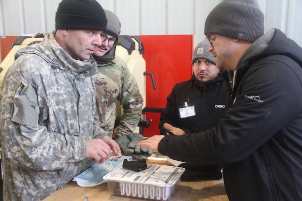 Staff from a Department of Defense Manufacturing Innovation Institutes (MIIs) member company demonstrates technology during the Office of the Secretary of Defense Manufacturing Technology Program's (OSD ManTech) Point of Need Challenge held at the U.S. Army Engineer Research and Development Center's Cold Regions Research and Engineering Laboratory in Hanover, N.H., Dec. 4, 2023.