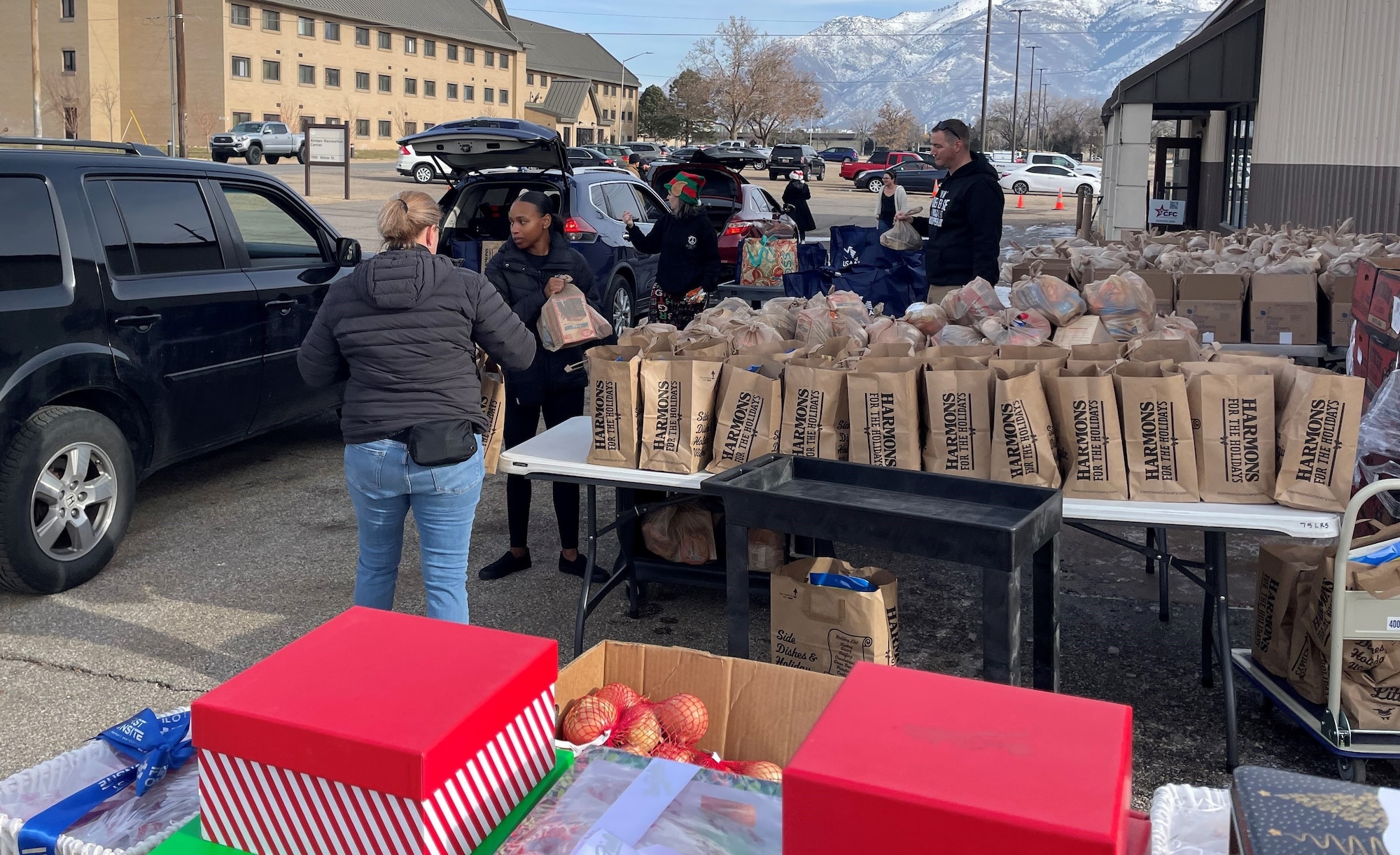 Volunteers distribute food, diapers, and toys to military families