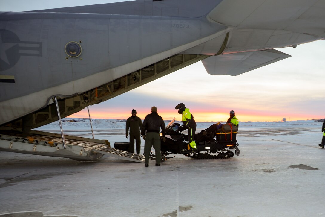 U.S. Marines with 4th Law Enforcement Battalion, Marine Forces Reserve, load snow machines onto a KC-130J Hercules assigned to Marine Aerial Refueler Transport Squadron (VMGR) 153, Marine Aircraft Group 24, 1st Marine Aircraft Wing to carry out the Toys for Tots mission in Kotzebue, Alaska, Dec. 13, 2023. VMGR-153 conducted combat assault transport and air delivery in support of Alaska Marines’ Toys for Tots mission which enhanced combat readiness and supported community relations in remote Alaskan villages. (U.S. Marine Corps photo by Staff Sgt. Olivia Ortiz)